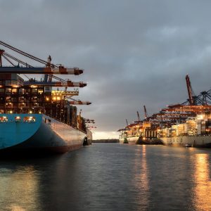 a couple of large ships sitting in a harbor
