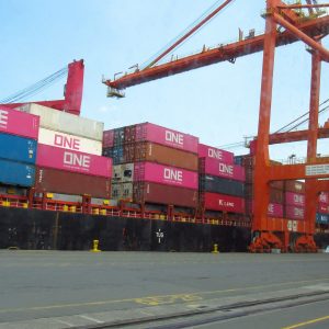 Cargo ship loaded with containers at a port.
