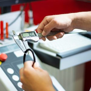 a person using a calculator on a machine
